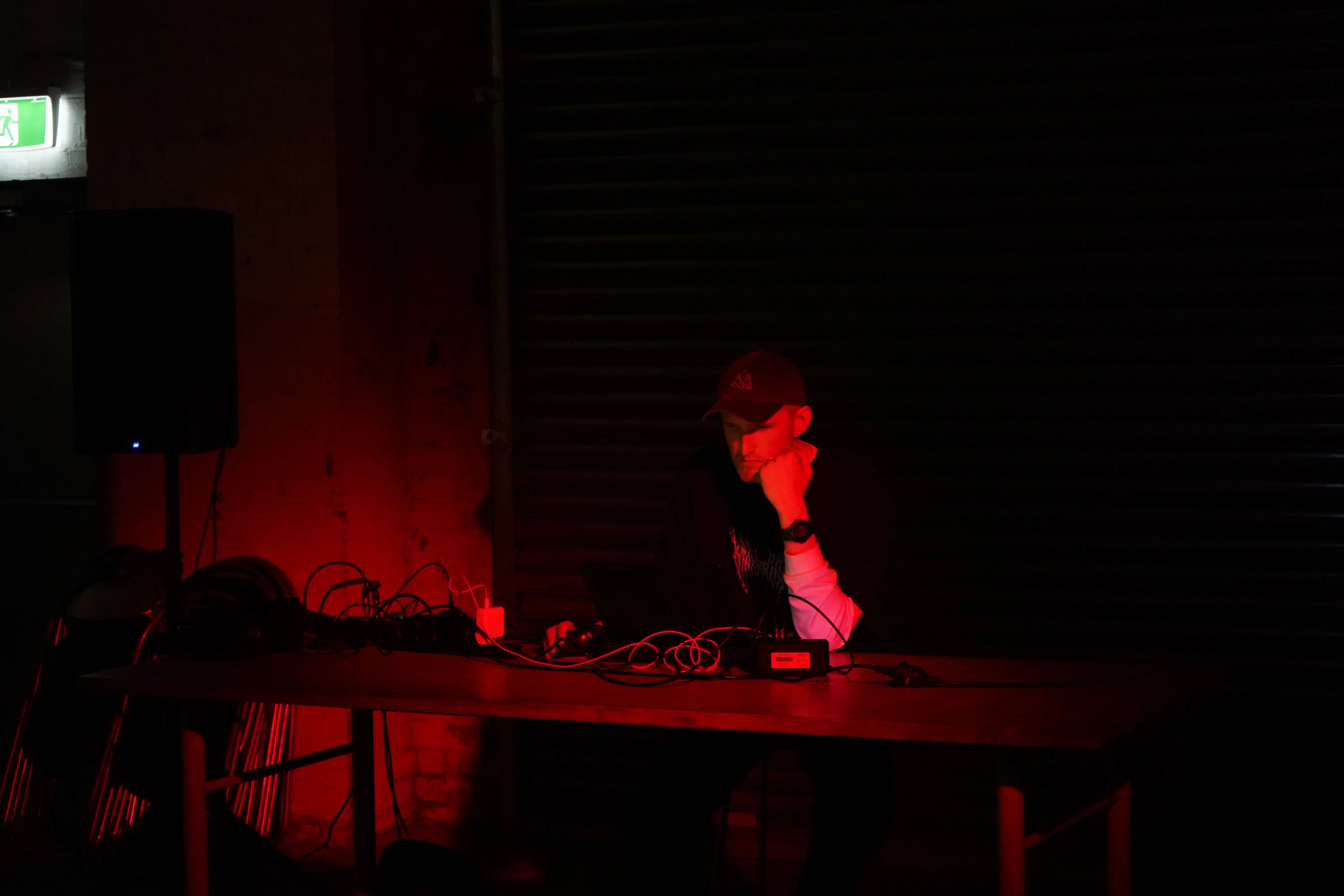 James Bradbury performing live, seated at a his laptop